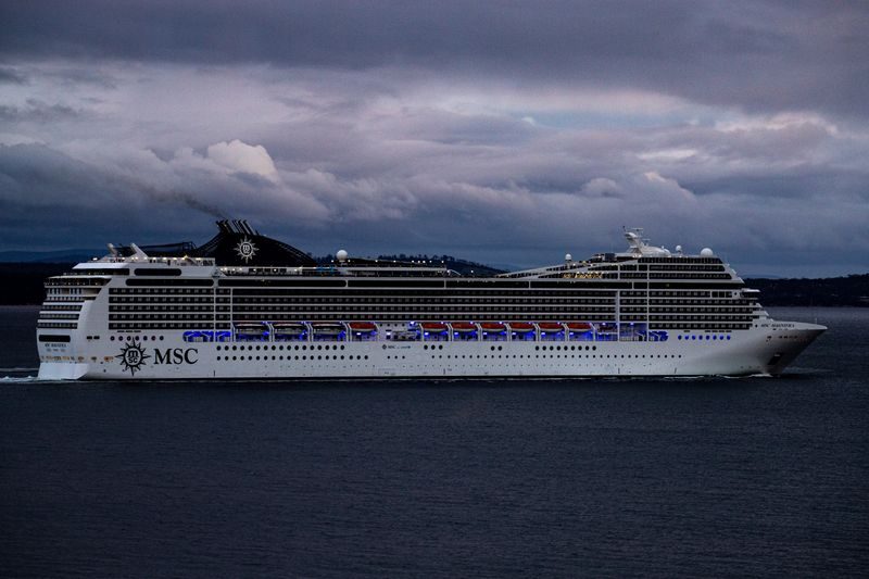 Cruise ship berthed alongside a port terminal at dusk