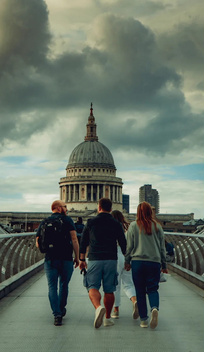 A group of people looking out across London towards the dome of St Paul’s Cathedral