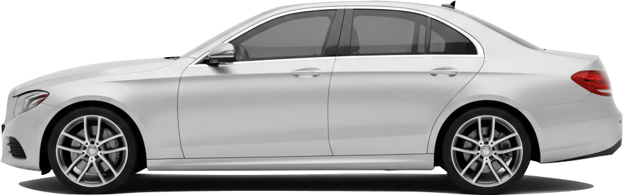 Rushxo executive car waiting at a UK airport terminal for a fixed-price transfer